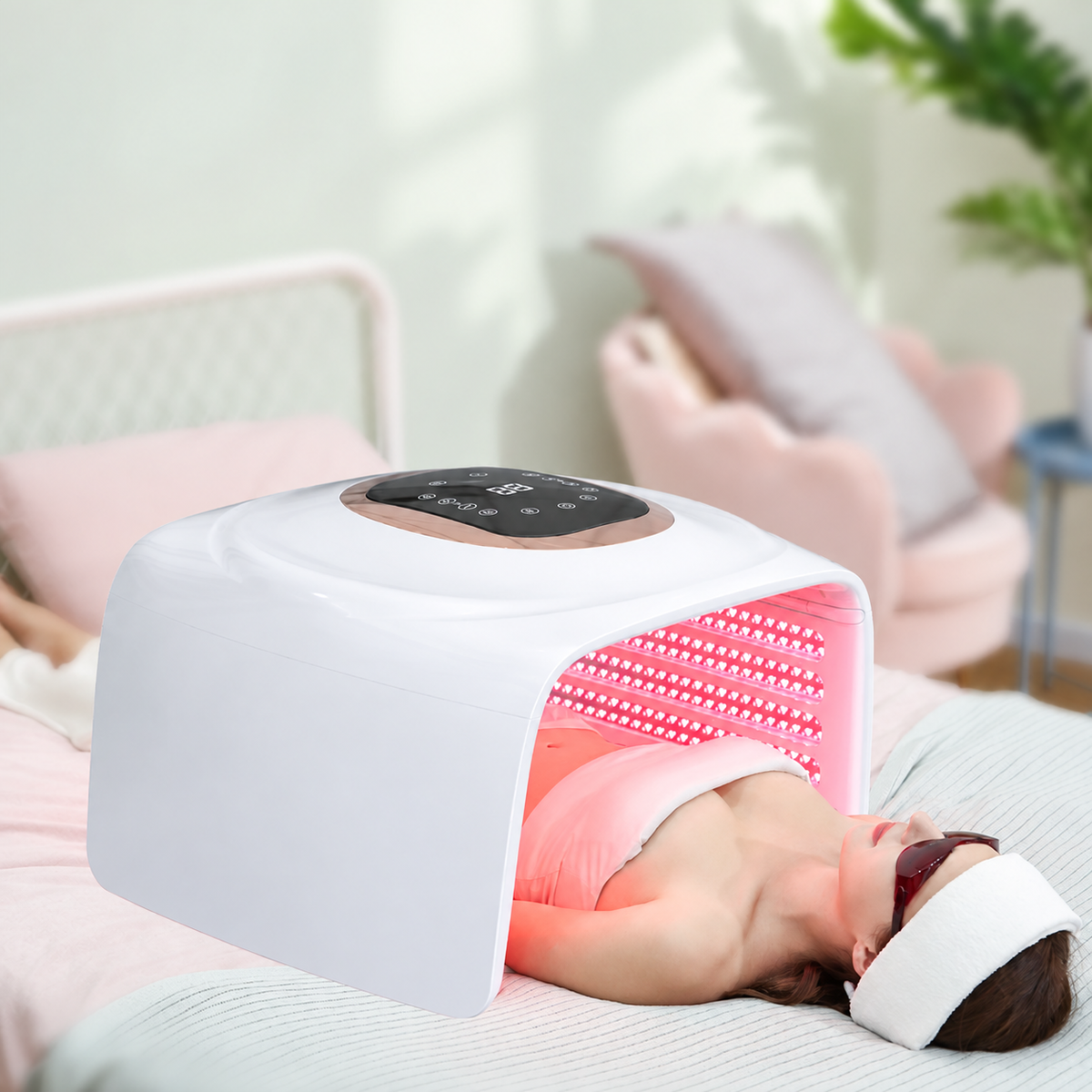 SQ112 fully unfolded in a red-light skincare session with protective eyewear